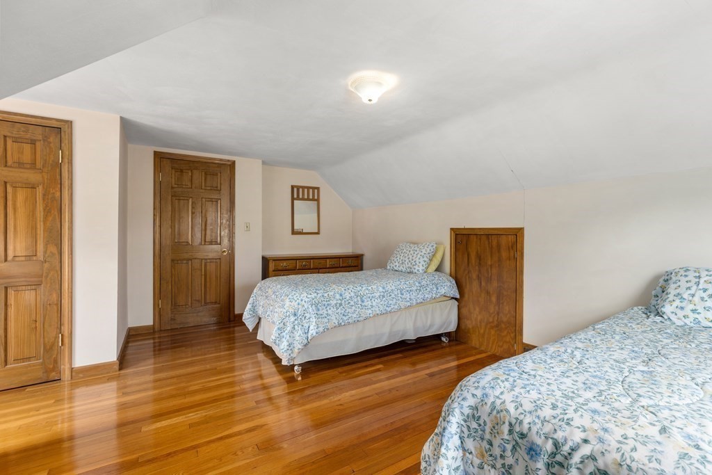 3 East Street Springfield, MA 01104 - Photo 17 of 29 a bedroom with two beds and painting on the wall