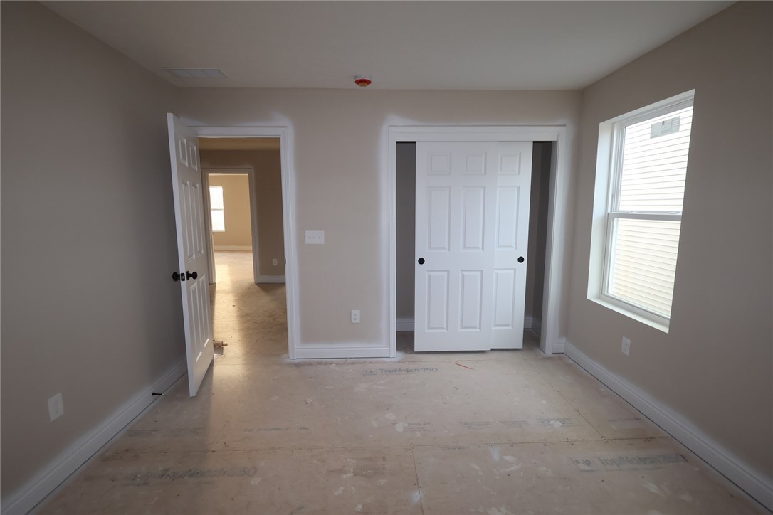 240 Tilly Court, Unit 5 Springboro, OH 45066 - Photo 3 of 26 This spacious room awaits your personal touch, offering an open canvas for your ideal living space.