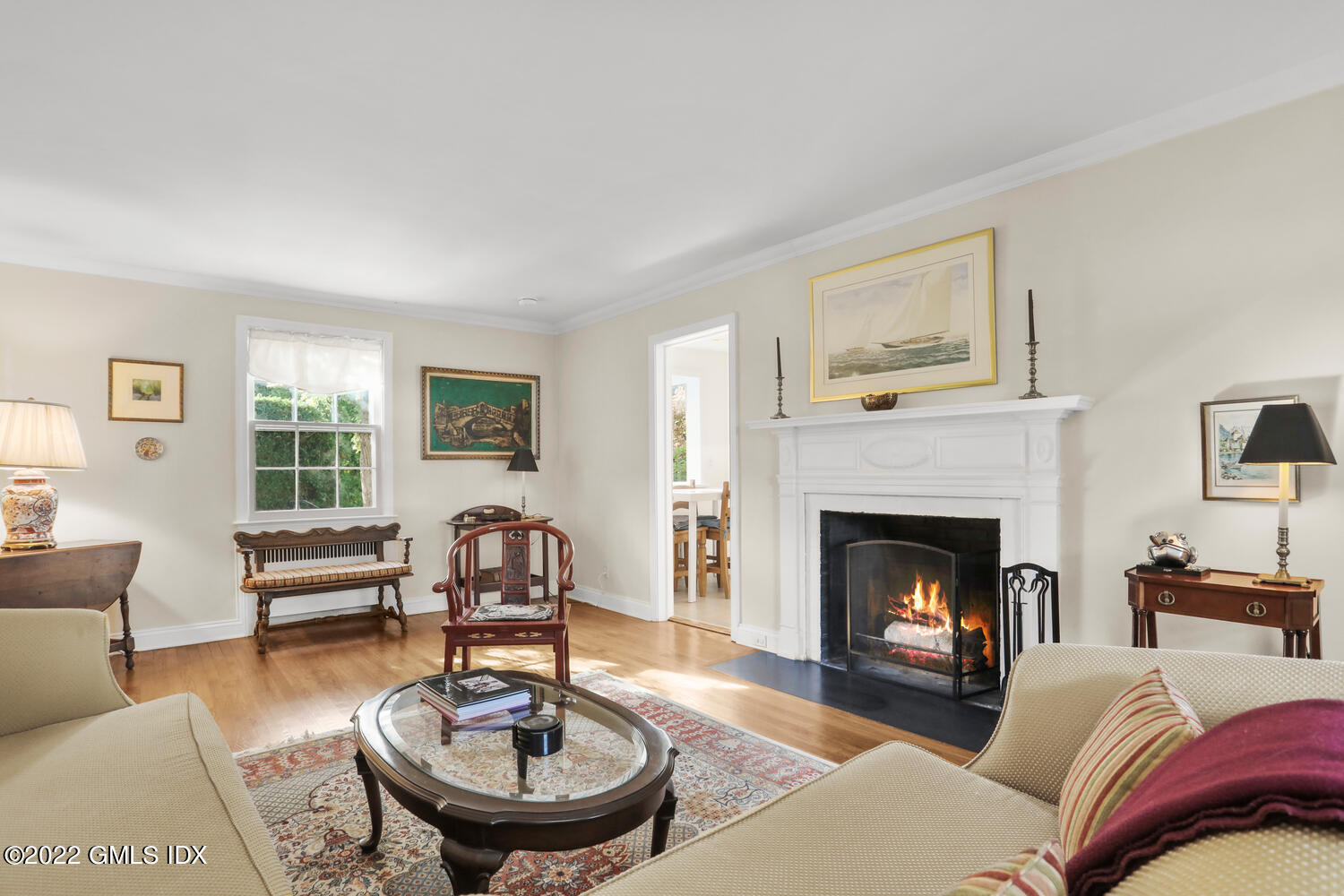 3 Wahneta Road Old Greenwich, CT 06870 - Photo 2 of 28 a living room with furniture a fireplace and a large window