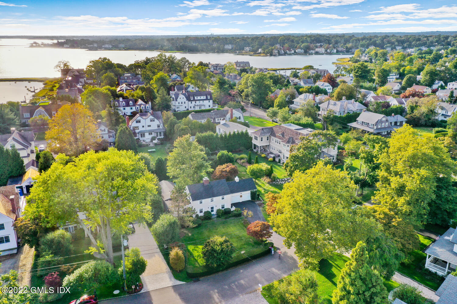 3 Wahneta Road Old Greenwich, CT 06870 - Photo 24 of 28 a view of a lake with a building in the background