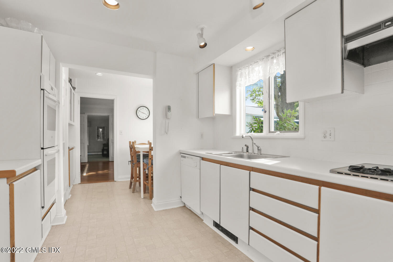 3 Wahneta Road Old Greenwich, CT 06870 - Photo 6 of 28 a kitchen with a sink and cabinets