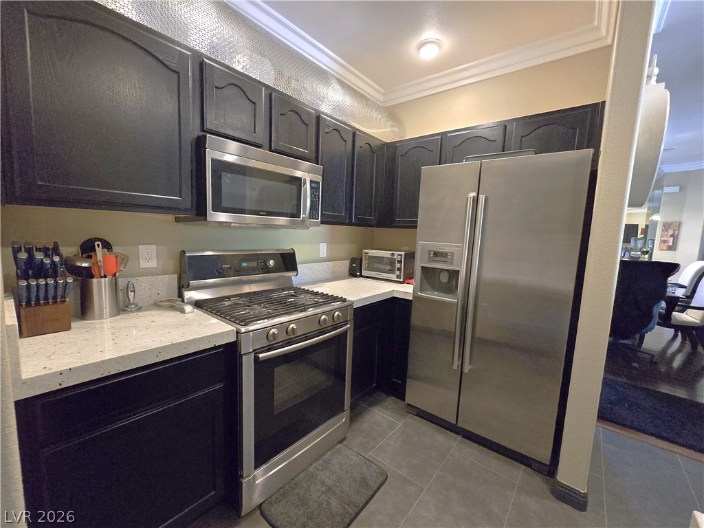 2050 West Warm Springs Road, Unit 2422 Henderson, NV 89014 - Photo 13 of 44 This modern kitchen features stainless steel appliances and ample counter space, perfect for culinary endeavors.