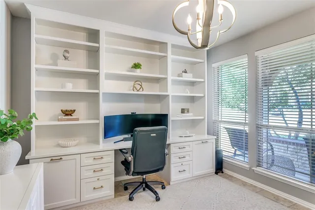 a view of a hallway with wooden floor and furniture