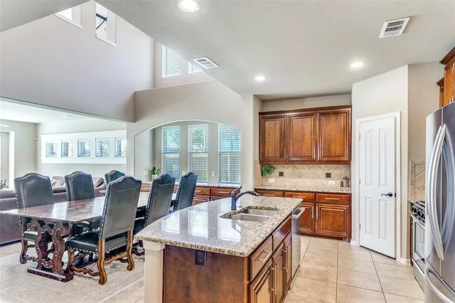 a view of a house with backyard porch and sitting area