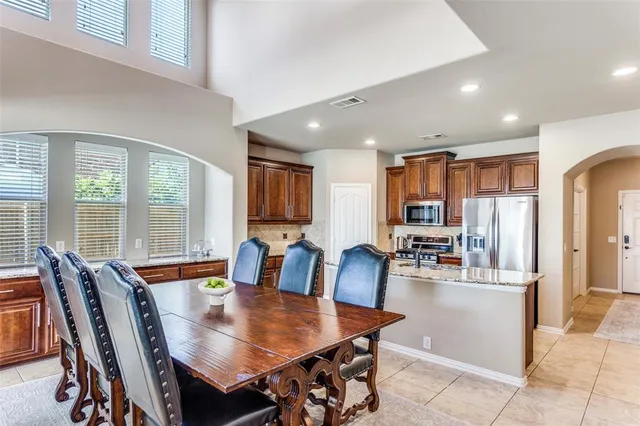 a view of a dining room with furniture window and outside view