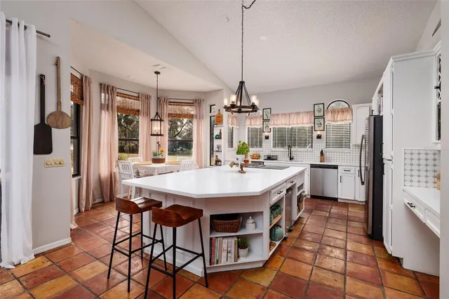 a bathroom with a sink a mirror and a shower
