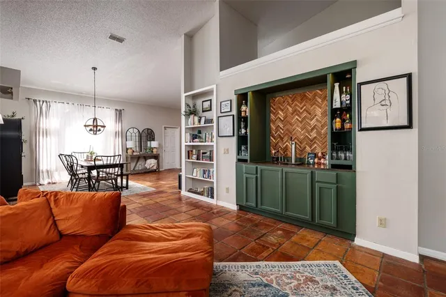 a living room with furniture and a toilet