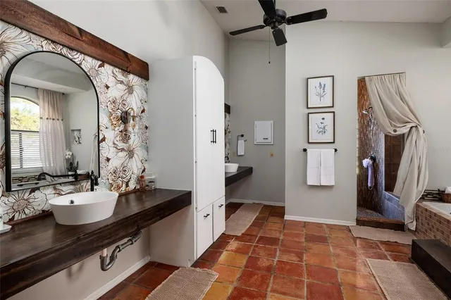 a bathroom with a toilet and a shower curtain