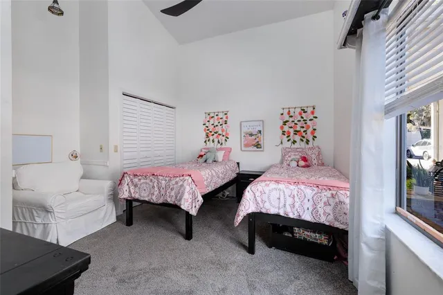 an aerial view of a house with a yard basket ball court and outdoor seating