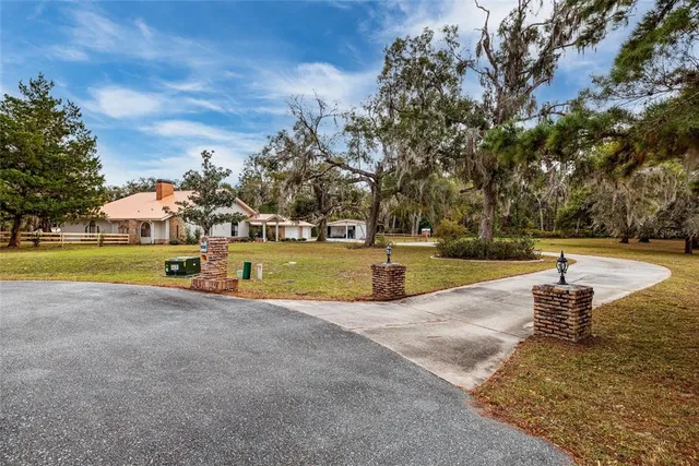 a view of swimming pool with outdoor seating and yard