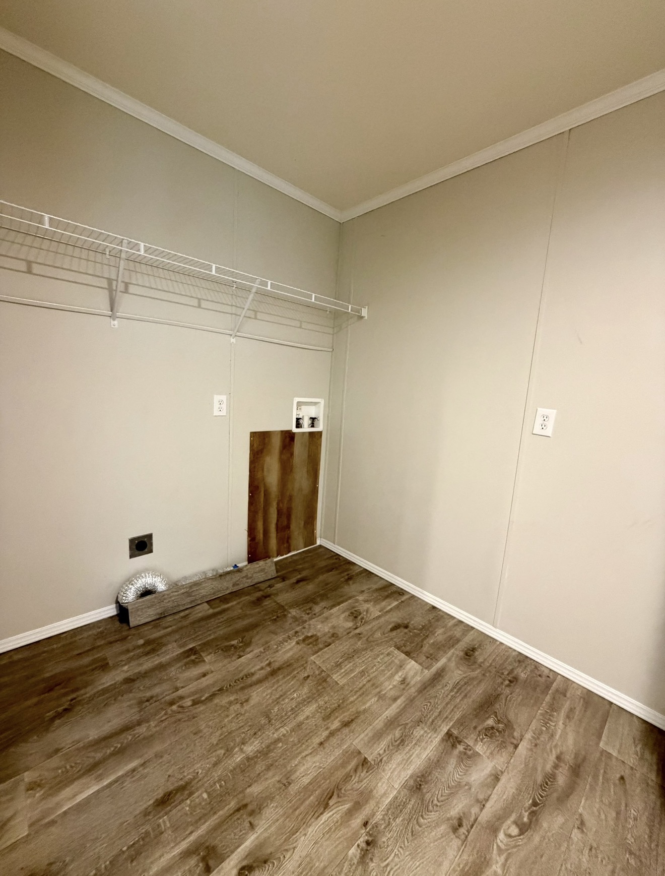 126 Castellana Way Elgin, TX 78621 - Photo 18 of 19 a view of a room with wooden floor