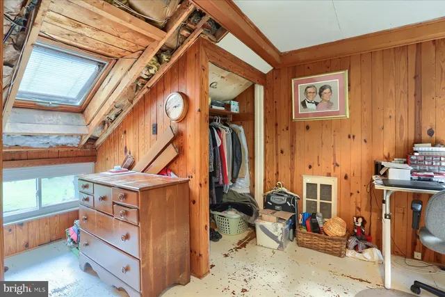 a view of living room with furniture and floor to ceiling window