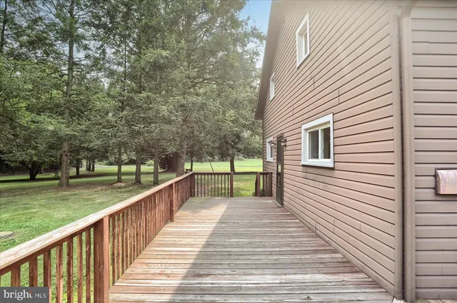 a view of wooden fence and trees
