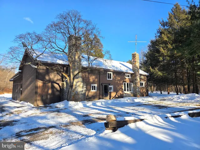 a view of a garden with a building in the background
