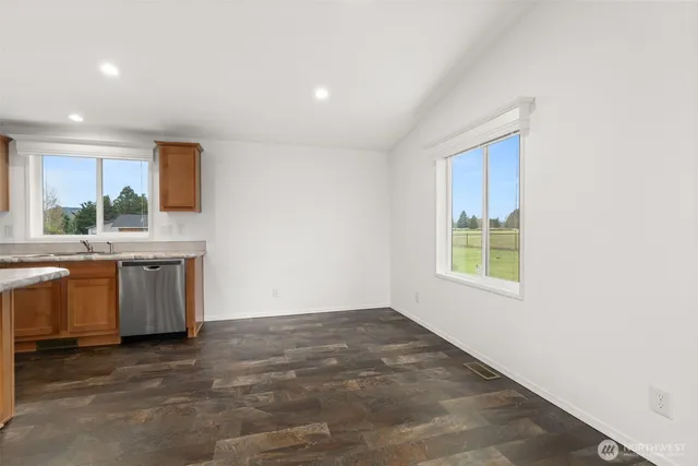 a view of a kitchen with a sink and a window