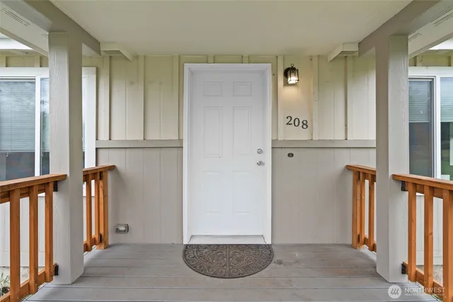 a view of an entryway with wooden floor