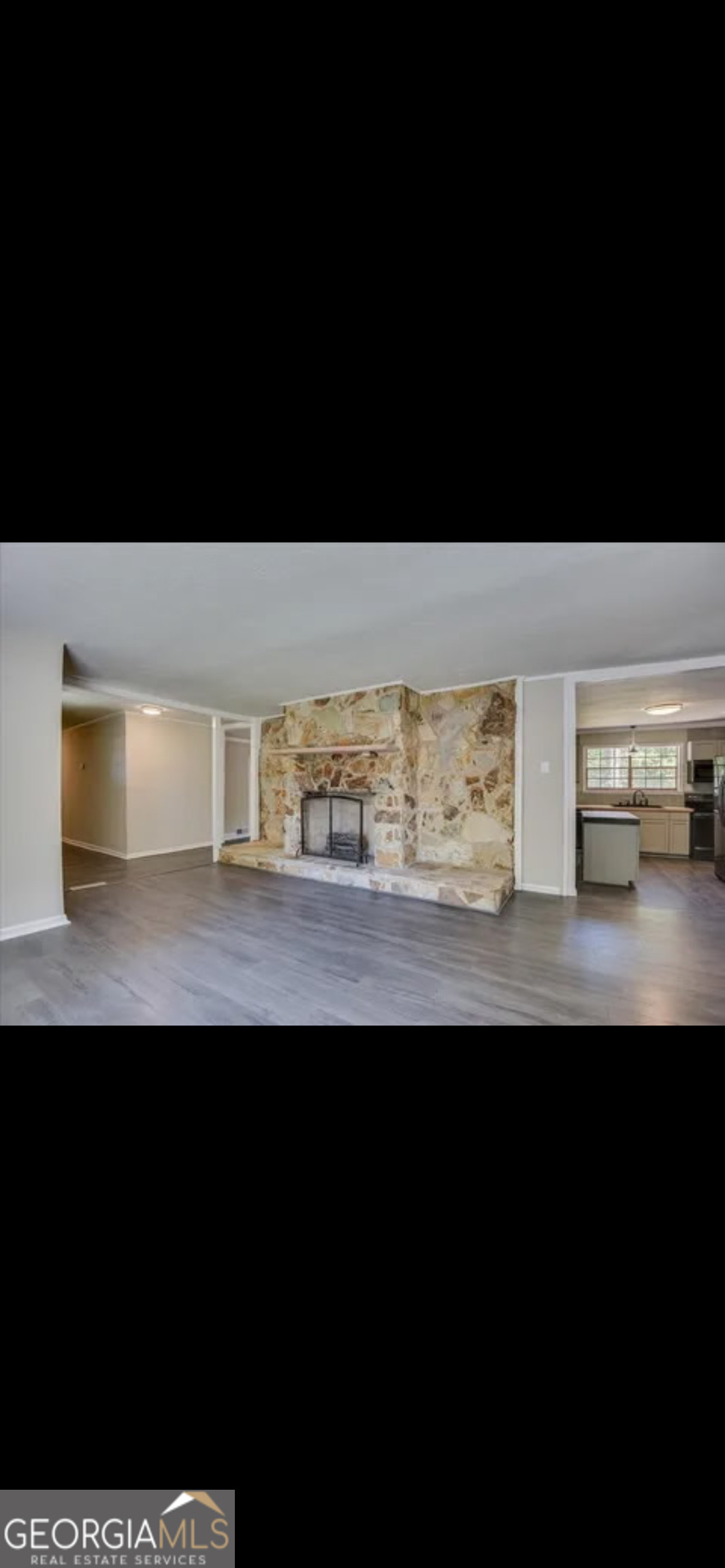 1065 Nathan Jones Road Harlem, GA 30814 - Photo 5 of 32 a view of kitchen island with wooden floor