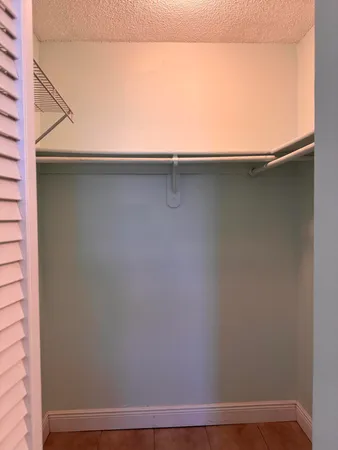 a bathroom with a sink a mirror and a shower