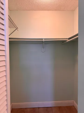 a kitchen with granite countertop a sink and cabinets