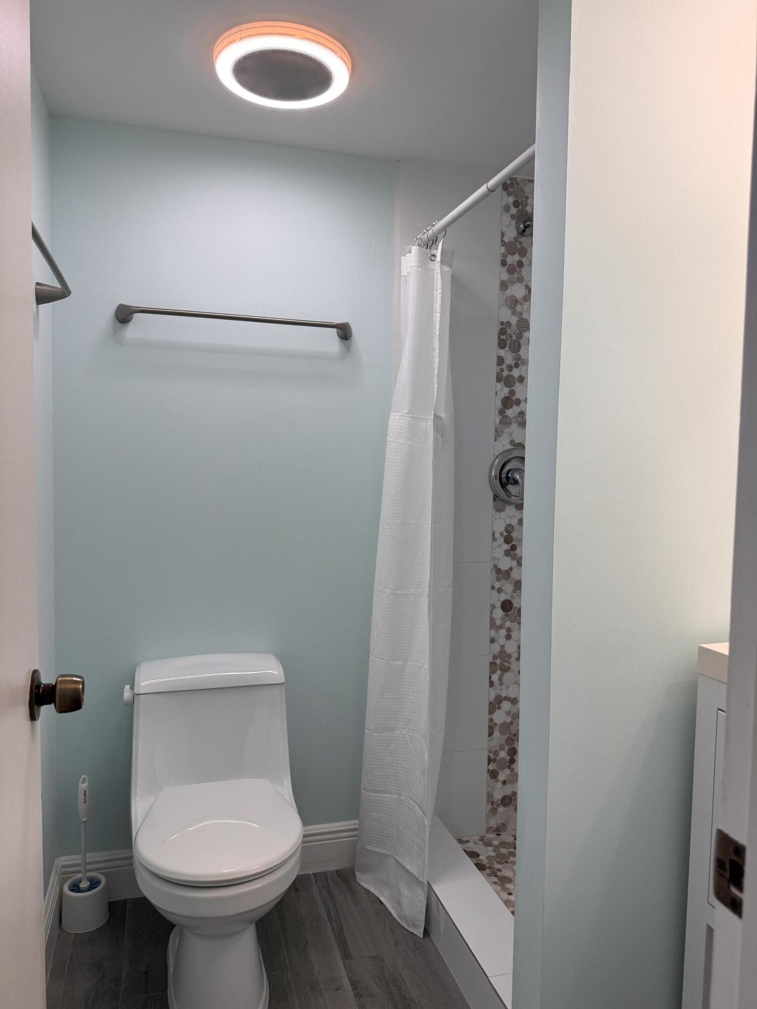 88540 Overseas Highway, Unit 203 Tavernier, FL 33070 - Photo 13 of 35 a bathroom with a toilet and a shower