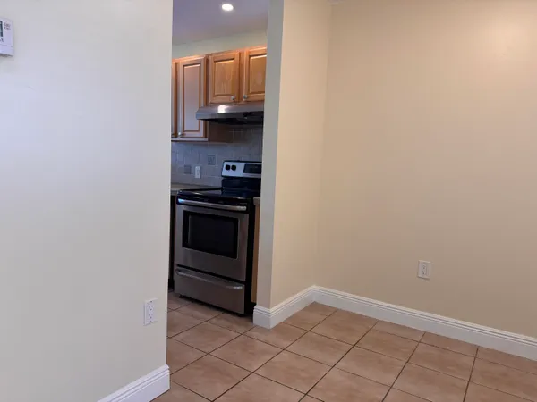 a view of hallway with a door
