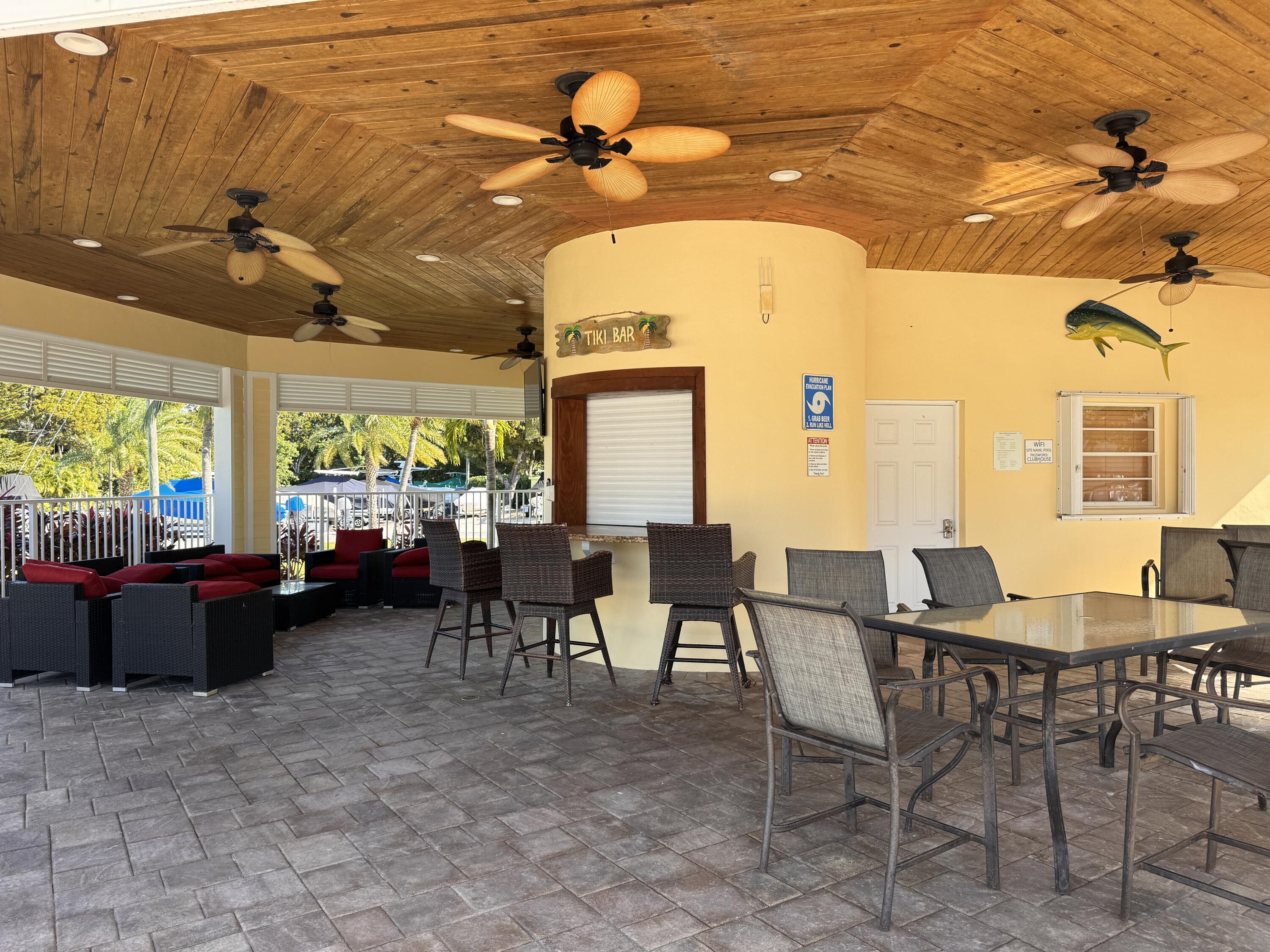 88540 Overseas Highway, Unit 203 Tavernier, FL 33070 - Photo 24 of 35 a view of a patio with a table and chairs