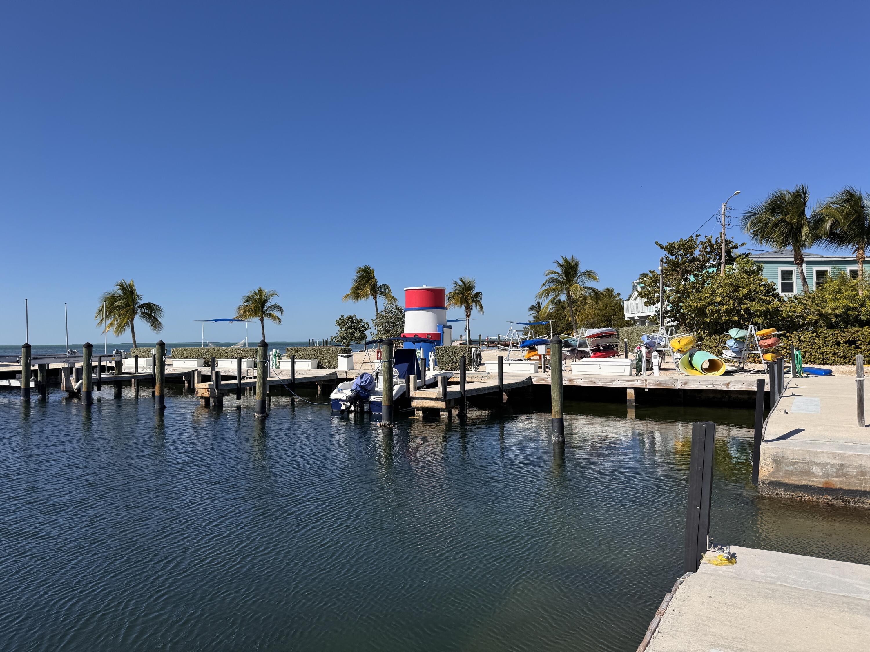 88540 Overseas Highway, Unit 203 Tavernier, FL 33070 - Photo 29 of 35 a view of swimming pool with outdoor seating