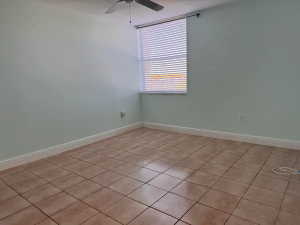an empty room with a bench