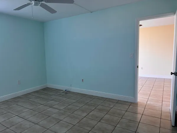 a bathroom with a toilet and a bath tub