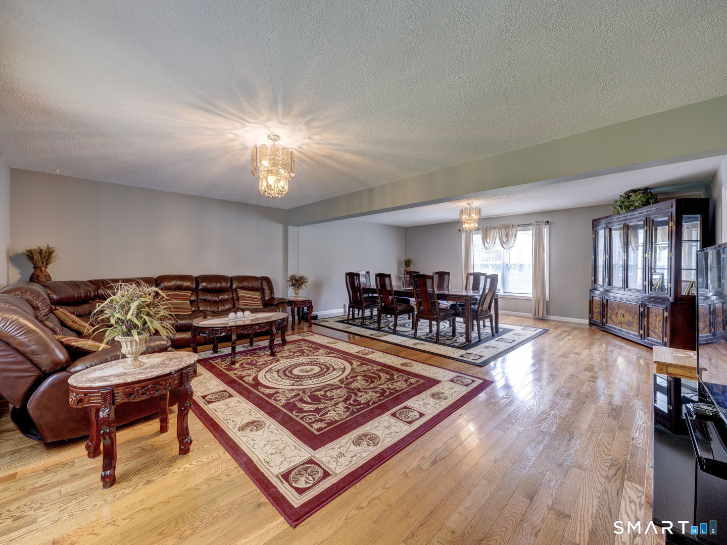 100 Mt Tobe Road Plymouth, CT 06782 - Photo 6 of 35 Great room , livingroom and dining room combination, wood floors , open concept.