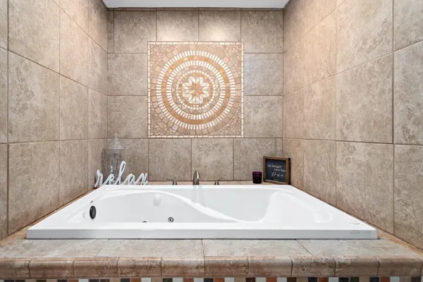 a bathroom with a bathtub and a sink