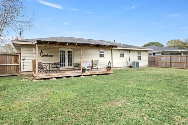 a view of a house with a yard and garage