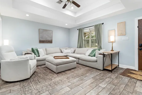 a living room with furniture and a window
