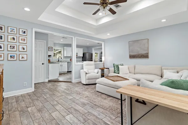 a living room with furniture and white walls