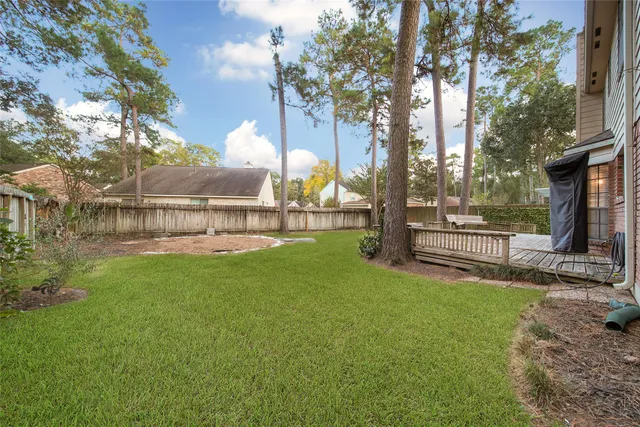 a view of a park with iron fence
