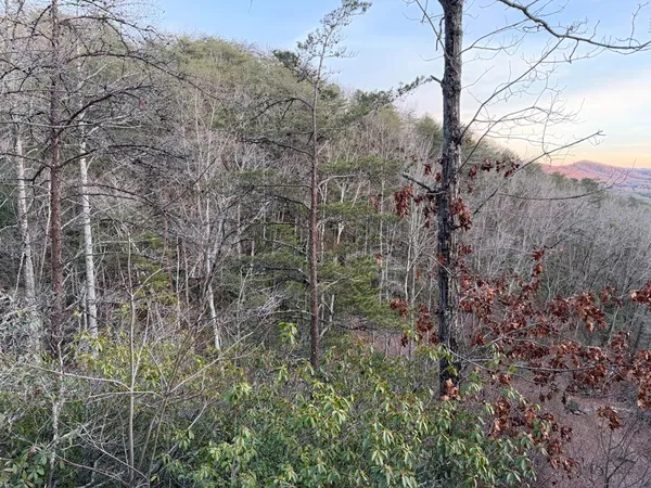 a view of deck with wooden floor and fence