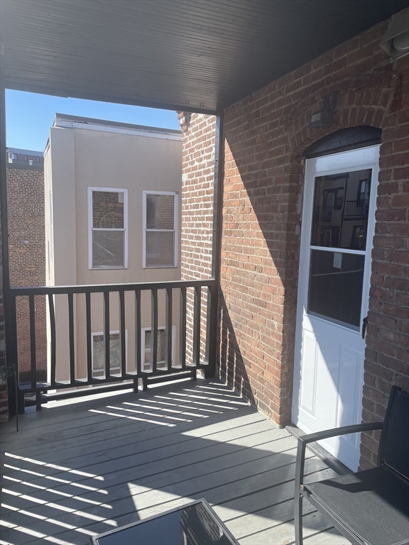 324 Summit Avenue, Unit 3 Boston, MA 02135 - Photo 14 of 16 a view of a balcony