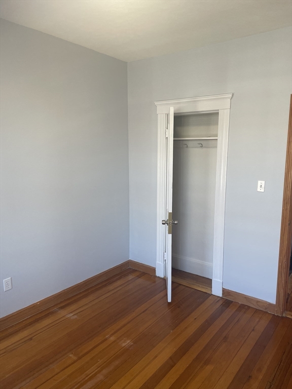 324 Summit Avenue, Unit 3 Boston, MA 02135 - Photo 7 of 16 a view of empty room with wooden floor