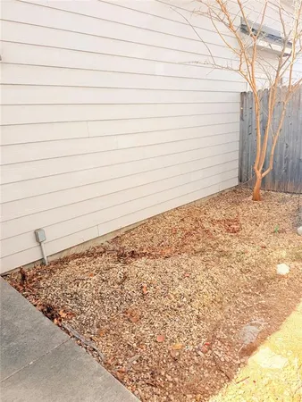 a view of a backyard of the house