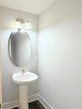 a bathroom with a sink and mirror