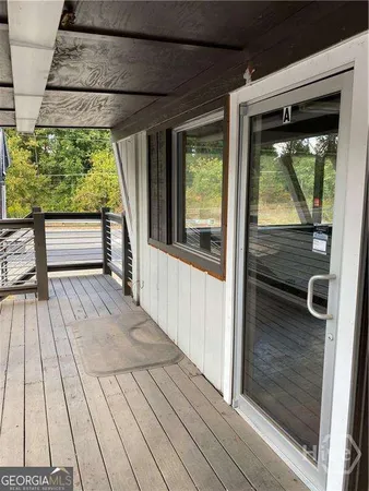 a view of hardwood floor and brick walls