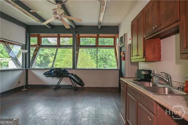 a kitchen with refrigerator and microwave