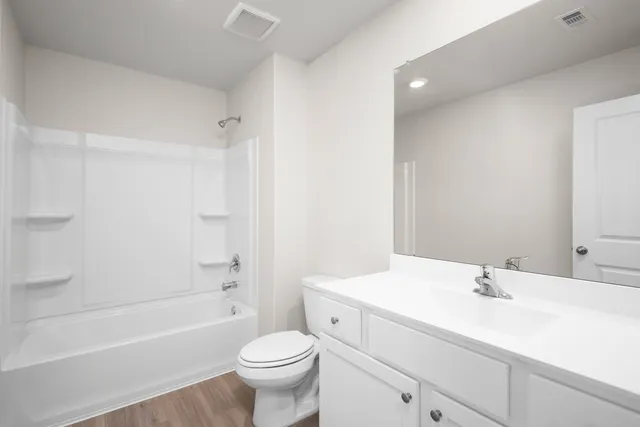 a bathroom with a sink a toilet and a bathtub