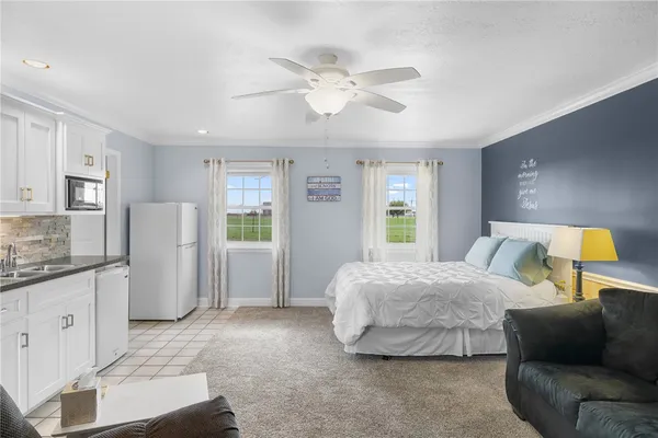 a bedroom with a bed and a couch