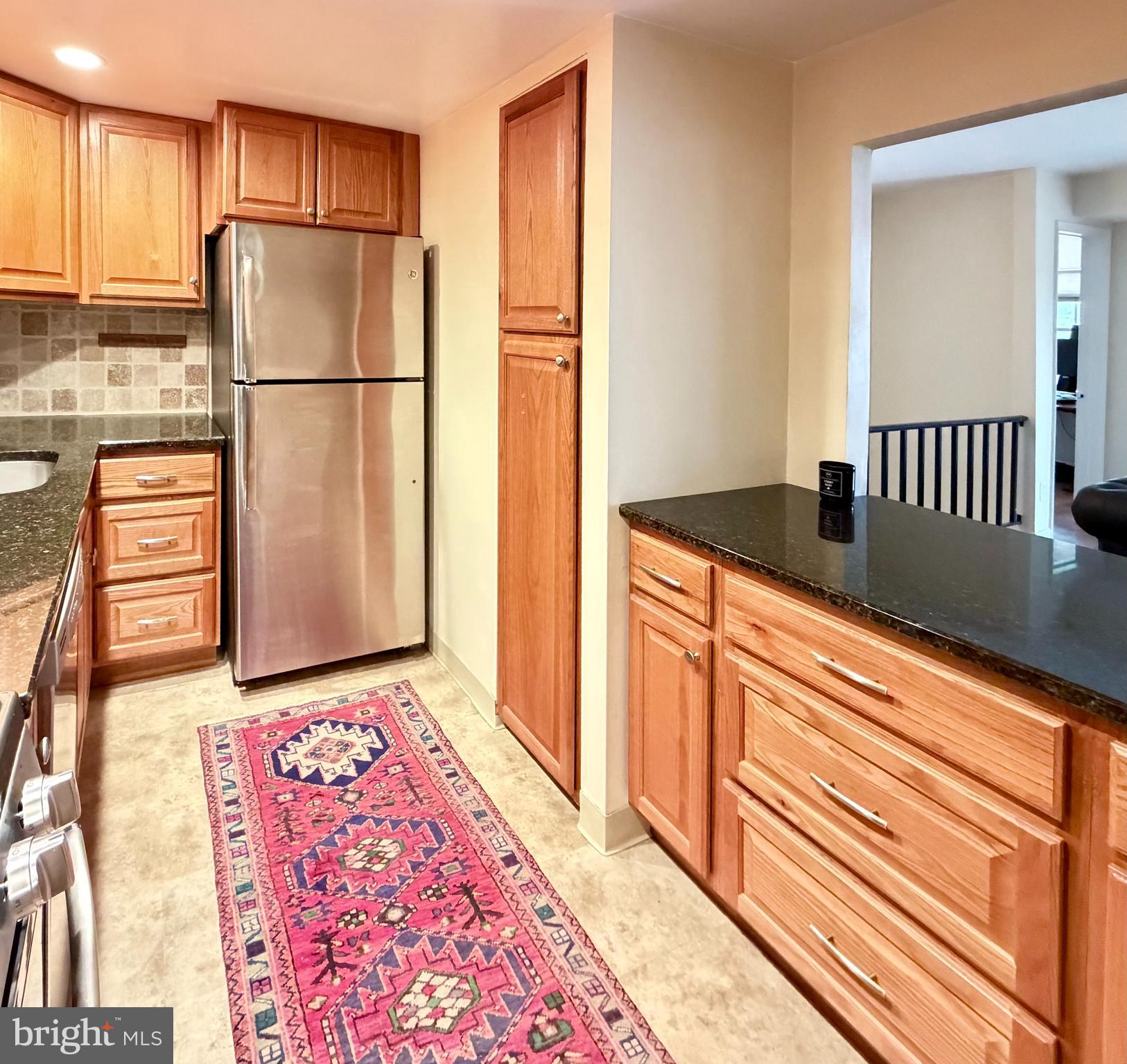 513 Old Forge Crossing, Unit 513 Wayne, PA 19087 - Photo 6 of 22 Kitchen Open to Living Rm