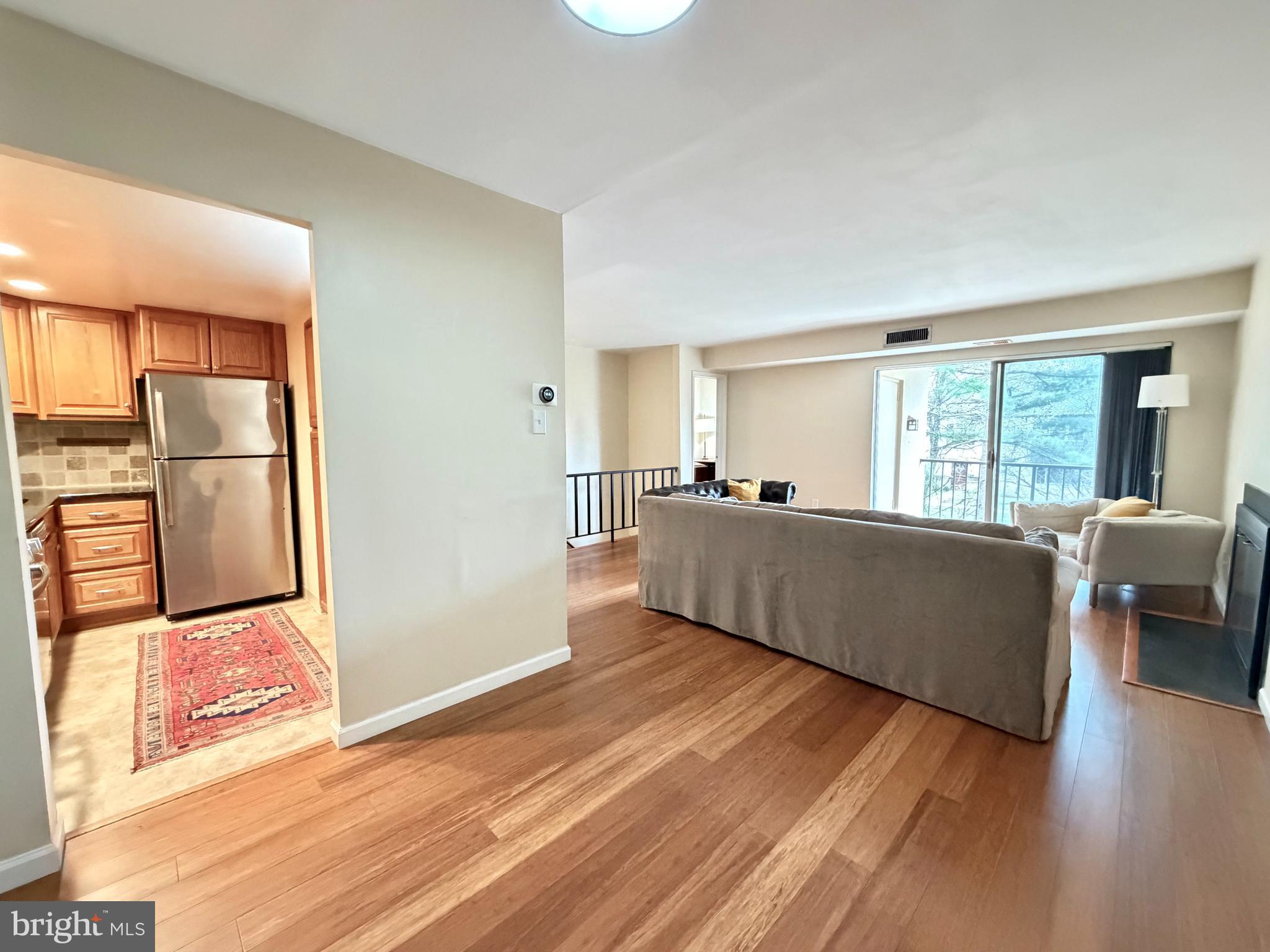 513 Old Forge Crossing, Unit 513 Wayne, PA 19087 - Photo 8 of 22 View from Dining Area to Kitchen & LR Balcony
