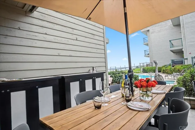 front view of a house with potted plants