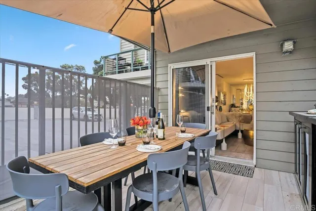 a bedroom with a large bed and painting on the wall
