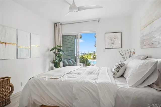 a bedroom with a bed and a mirror