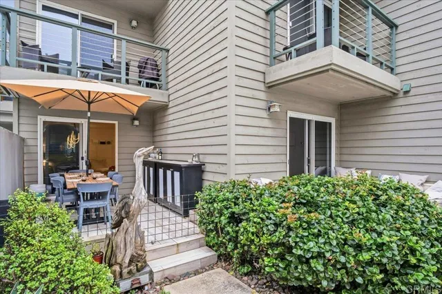 a swimming pool with outdoor seating
